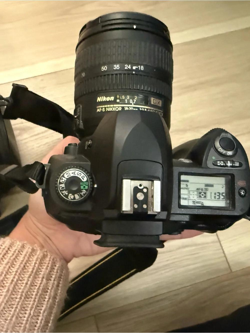 Nikon DSLR Camera in Black with Attached Lens